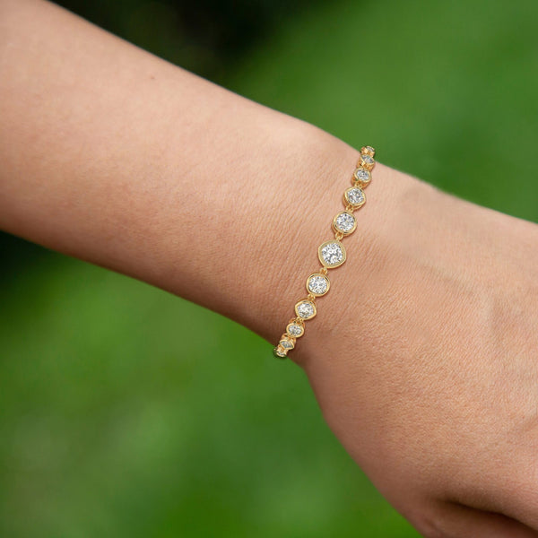 14K Solid Gold Lab Grown Diamond Bracelet | 9 Graduated Diamonds Bezel Set - Side View | Riyanika Jewels