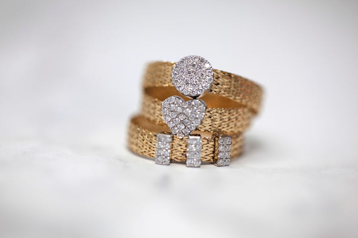 Stacked 18K gold and diamond rings showcasing 2026 jewelry trends - Riyanika Jewels