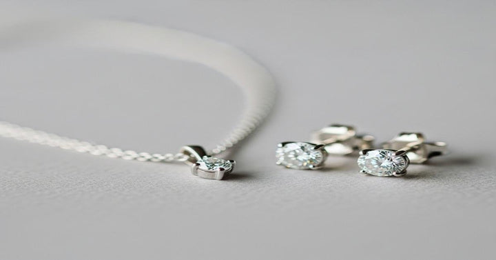 Minimalist 18K gold bridal jewelry with solitaire diamond pendant and delicate chain for modern weddings