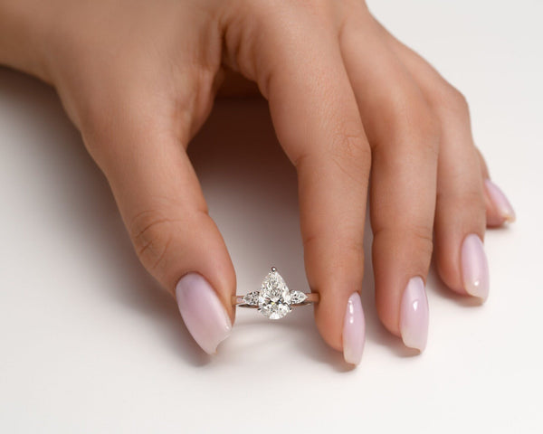 18K Solid Gold 2ct Pear Natural Diamond with Pear Side Stones Three Stone Engagement Ring - Side View | Riyanika Jewels